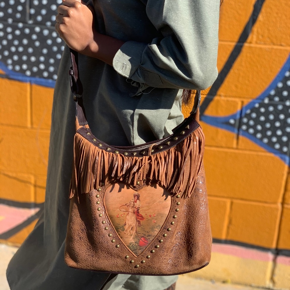 Giddy up saddle fringe vintage bag